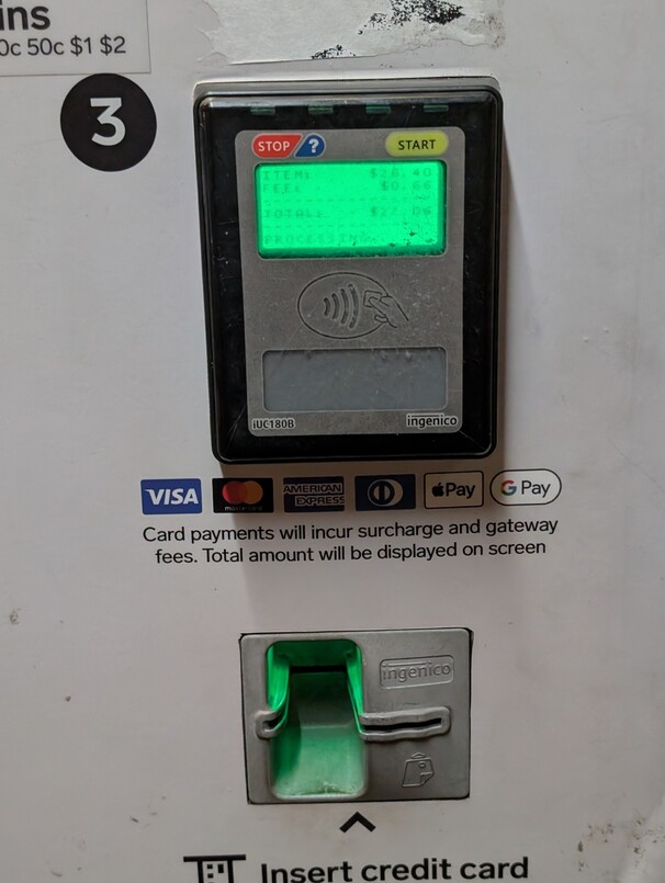 “ITEM:     $26.40”, “FEE:       $0.66”, “TOTAL:    $27.06”, “PROCESSING...”