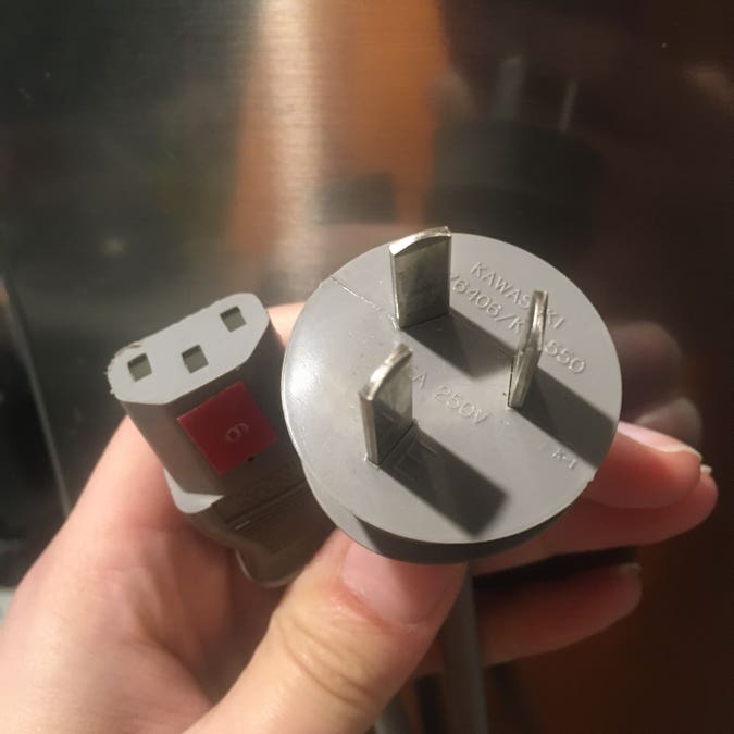 gray kettle cord with australian male plug, old enough to not have insulated live and neutral pins, but not old enough to be made of folded brass