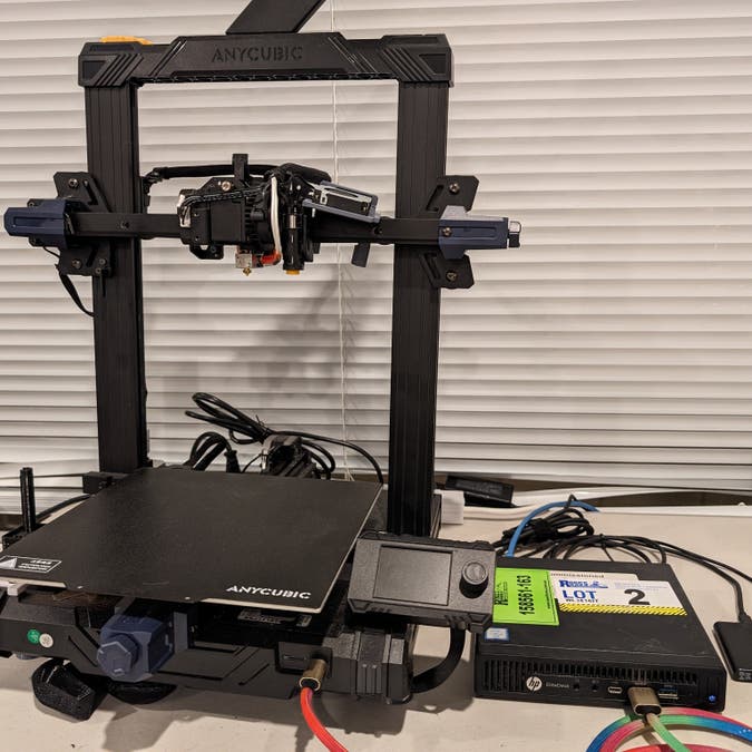 one hp mini-sff computer on a bunnings plastic trestle table, next to our 3d printer