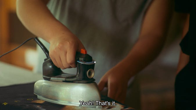 cheese from reservation dogs ironing a printed tee