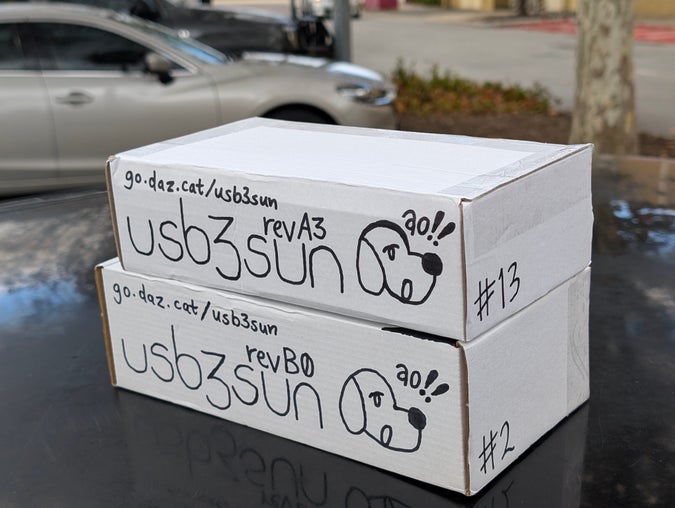 two usb3sun boxes, one rev A3 and one rev B0, with the usual hand-drawn box art