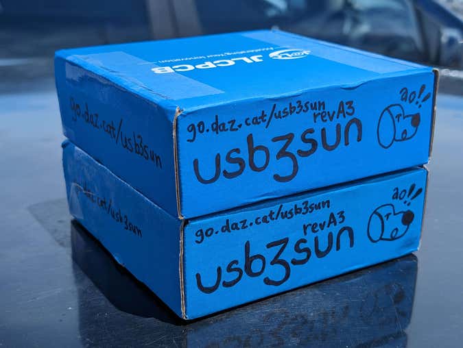 two boxes for usb3sun adapters, sitting on the roof of my car