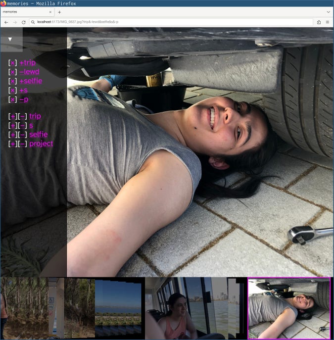 screenshot of gallery showing a picture of me changing the oil filter for my car, a timeline along the bottom, and a sidebar with several tags (“trip”, “s”, “selfie”, “project”) and tag filters (“+trip”, “−lewd”, “+selfie”, “+s”, “−p”).