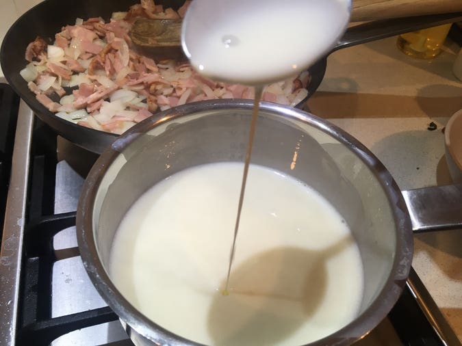 béchamel made with milk and corn flour (instead of roux), plus onion and bacon frying in the background